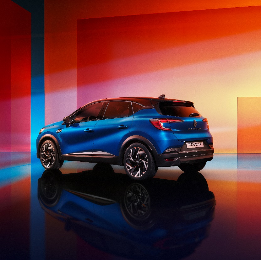 A blue car parked in a room

Description automatically generated
