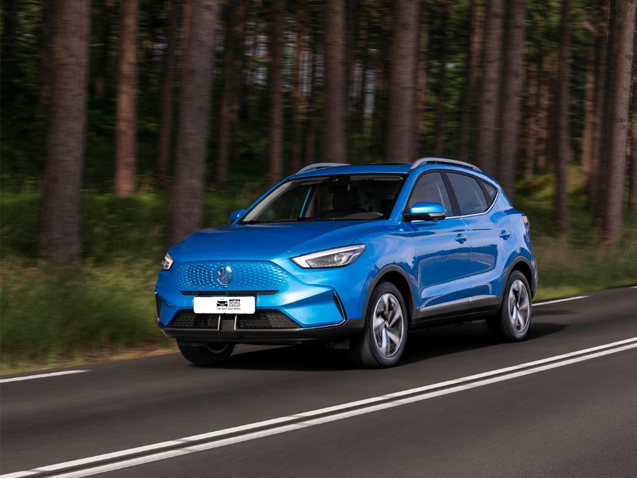 A blue car on a road

Description automatically generated